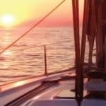 Sailboat on the sea in Crete sunset